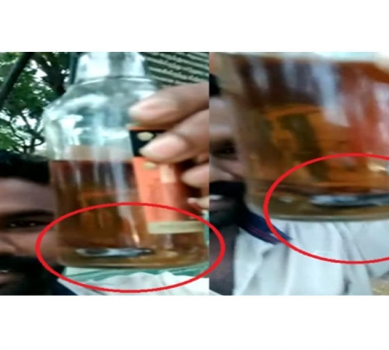 మందుబాబుకు షాక్: మద్యం సీసాలు పామును చూసి… 