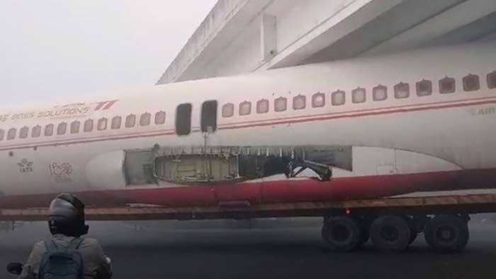 Plane Stuck Under Bridge