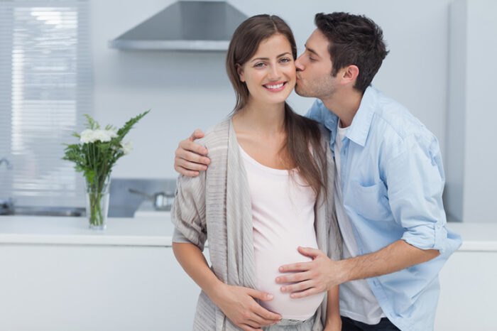 Man Caring For Pregnant Wife