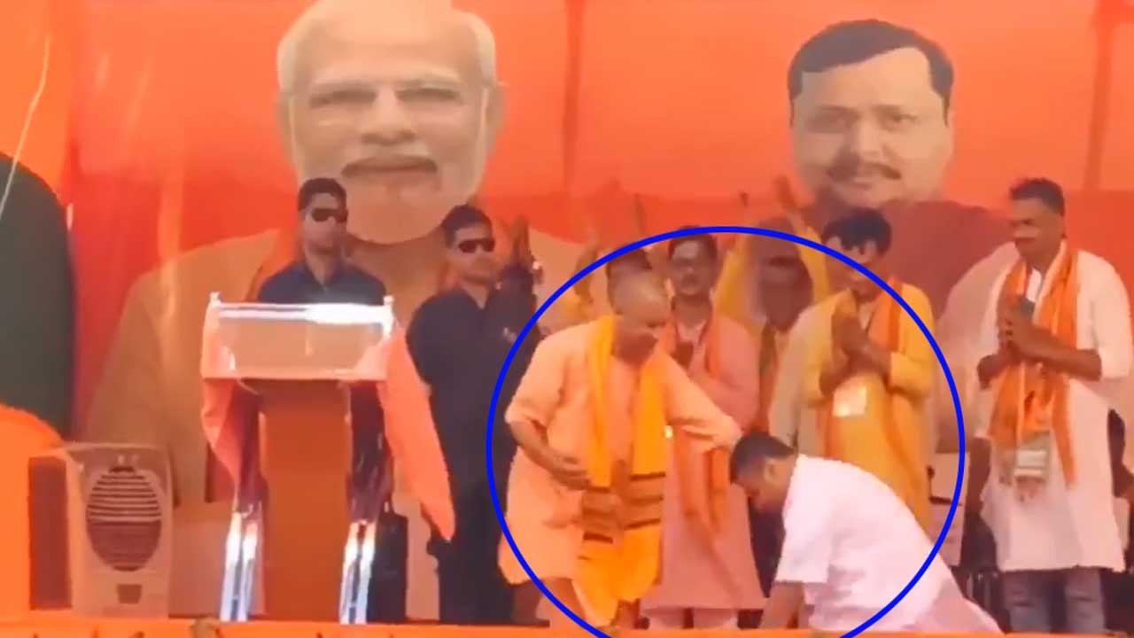 suvendu adhikari touches yogi adityanath feet bengal election campaign viral video