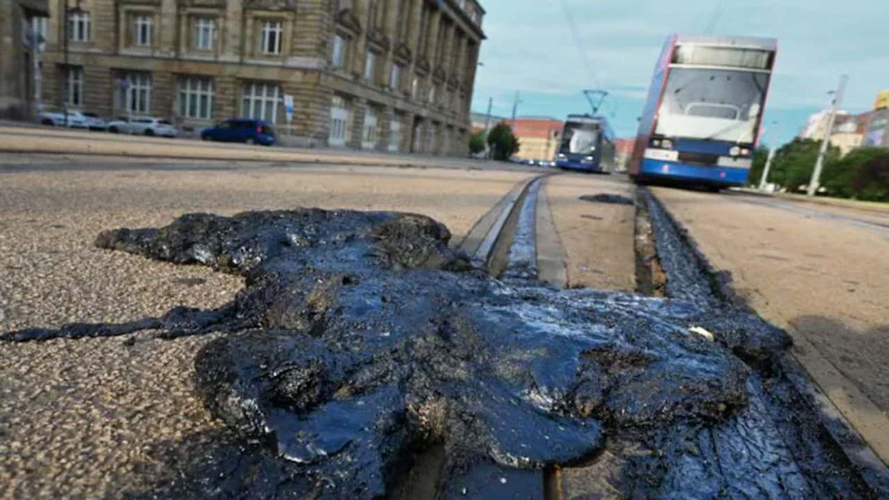 europe record heatwave roads melt tram tracks buckle 1300 heat deaths