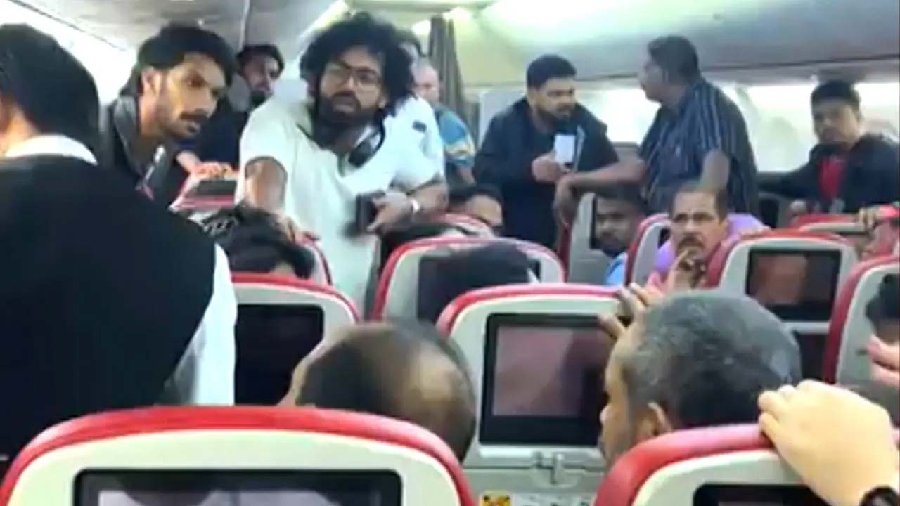 kochi flight passenger tries to open emergency exit arrested